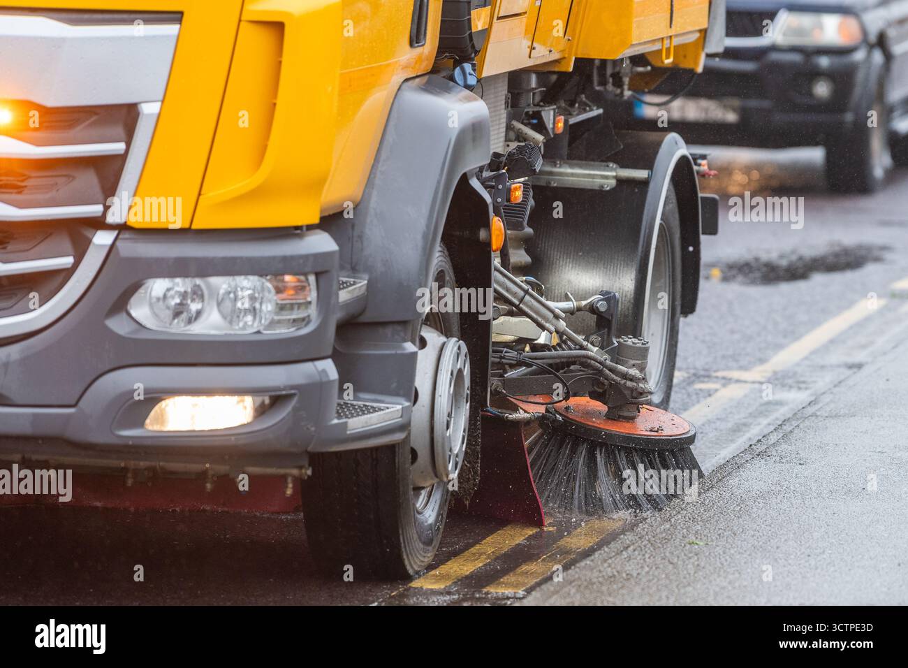 Road sweeper in action on a construction site