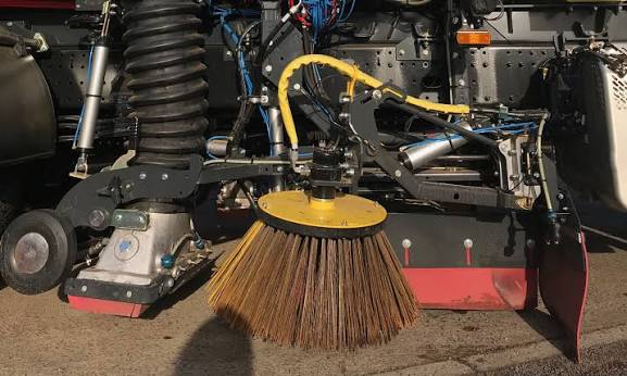Road sweeper on a busy street in London